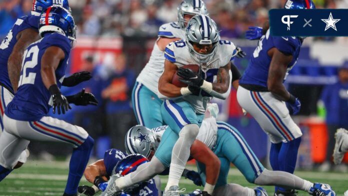 Tony Pollard (20) runs with the ball against the New York Giants during the second half at MetLife Stadium.