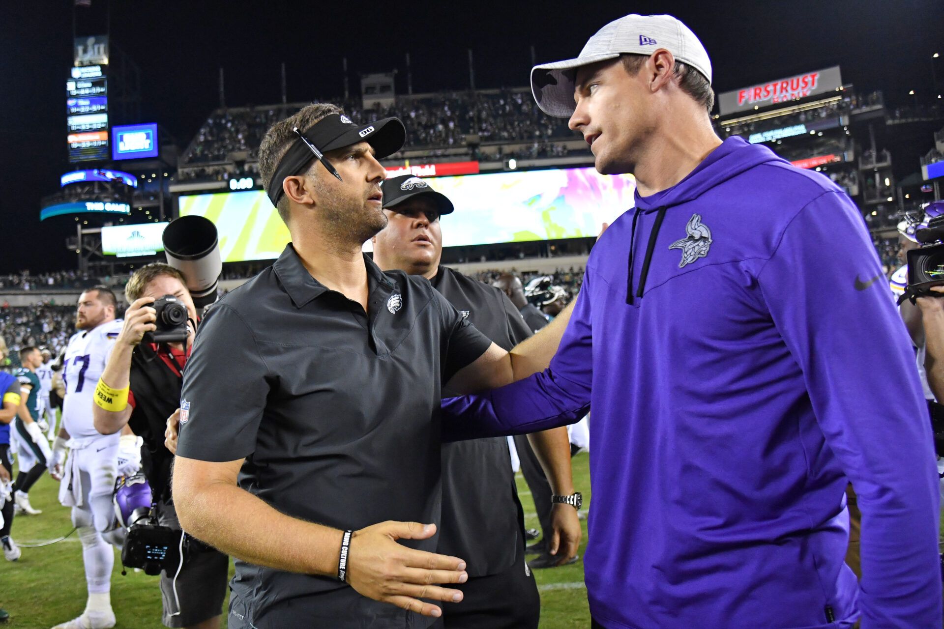 Philadelphia Eagles head coach Nick Sirianni meets with Minnesota Vikings head coach Kevin O'Connell after the game at Lincoln Financial Field.