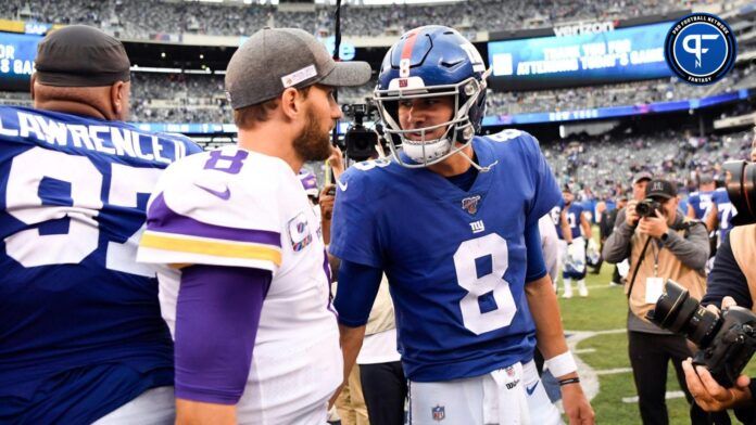 Kirk Cousins (8) and New York Giants quarterback Daniel Jones (8) talk after the game.