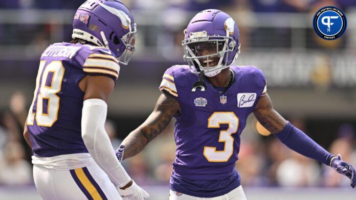 Jordan Addison (3) reacts with wide receiver Justin Jefferson (18) after scoring his first career touchdown pass from quarterback Kirk Cousins (not pictured) against the Tampa Bay Buccaneers during the second quarter at U.S. Bank Stadium.