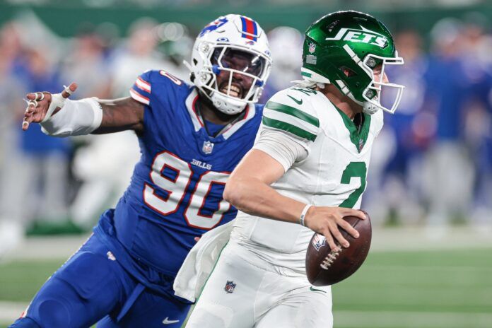 Buffalo Bills DE Shaq Lawson (90) attempts to sack New York Jets QB Zach Wilson (2).