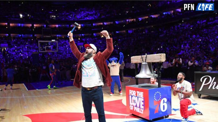 Philadelphia Eagles center Jason Kelce encourages the crowd before ringing the bell against the Boston Celtics before game three of the 2023 NBA playoffs at Wells Fargo Center.