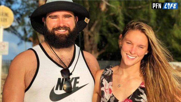 Jason Kelce and his wife, Kylie, smile for a picture.