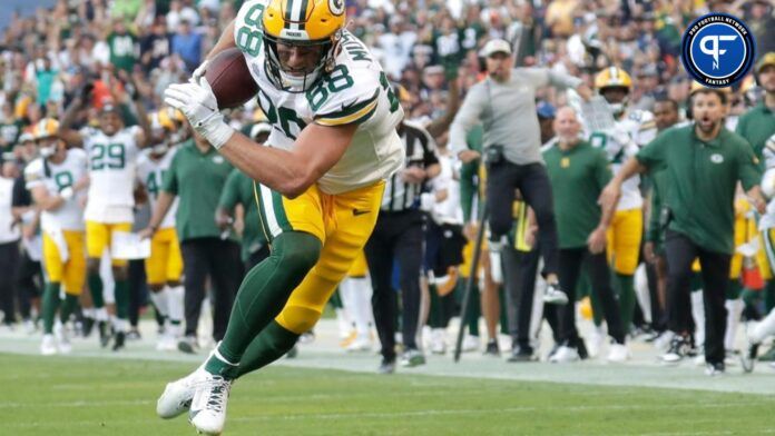 Green Bay Packers TE Luke Musgrave rushes forward after a catch.