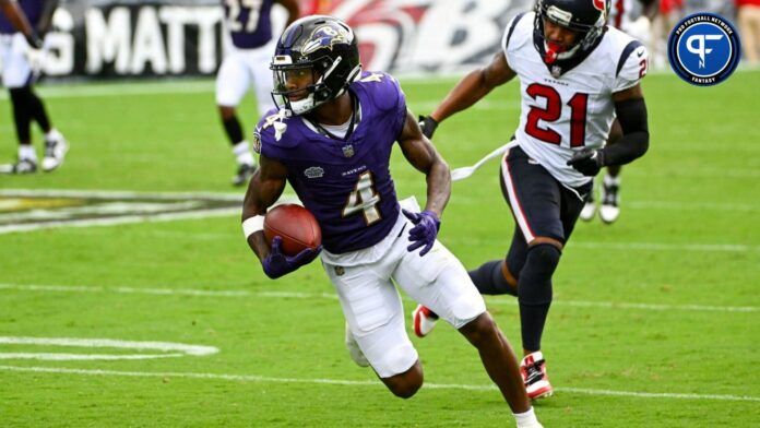 Baltimore Ravens wide receiver Zay Flowers (4) runs after a reception as Houston Texans cornerback Steven Nelson (21) chases during the second half at M&T Bank Stadium.