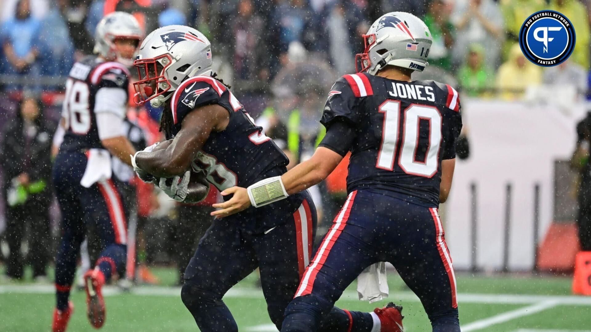 New England Patriots quarterback Mac Jones (10) hands the ball off to New England Patriots running back Rhamondre Stevenson (38) during the first half against the Philadelphia Eagles at Gillette Stadium.