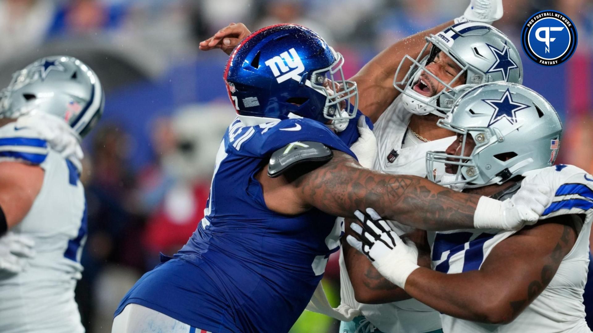 New York Giants defensive tackle Dexter Lawrence II (97) slams into Dallas Cowboys quarterback Dak Prescott (4) after the ball was released.