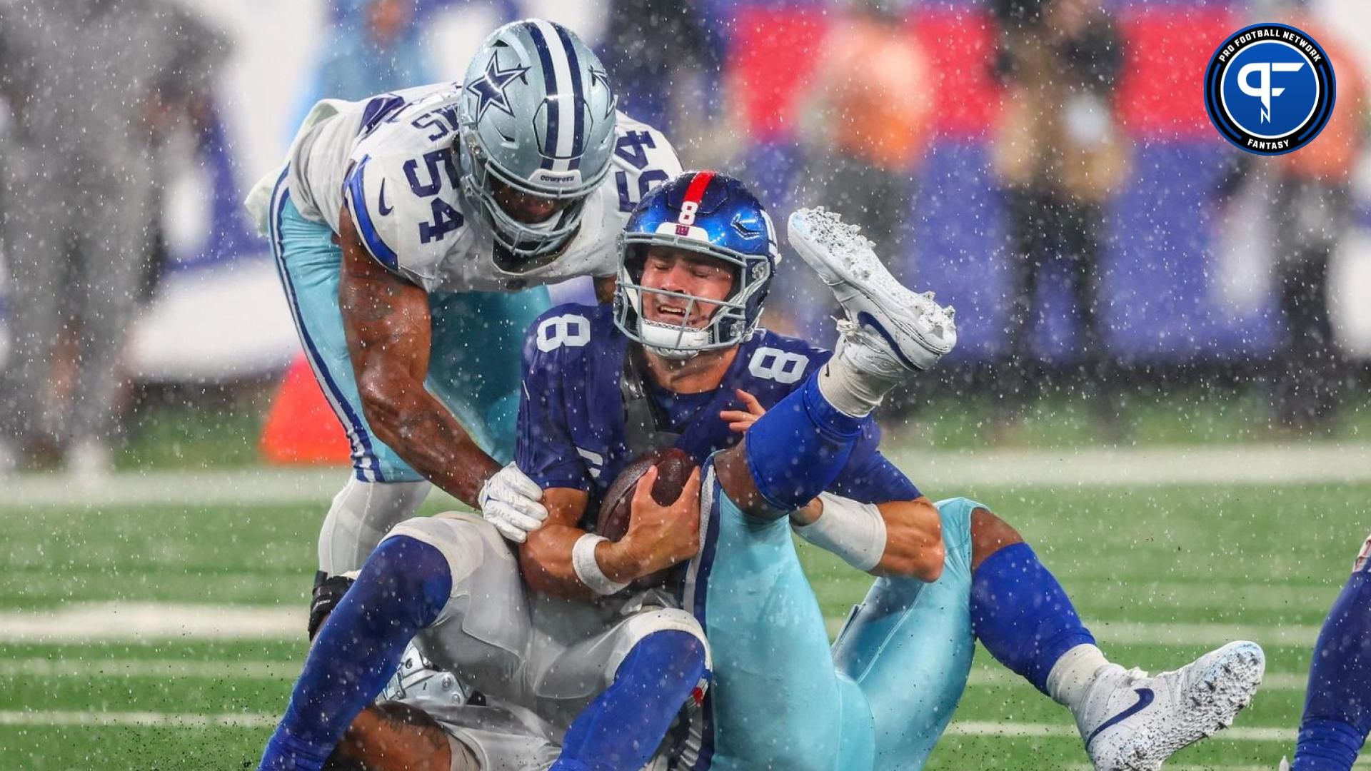 New York Giants quarterback Daniel Jones (8) is sacked by Dallas Cowboys linebacker Micah Parsons (11) during the second half at MetLife Stadium.