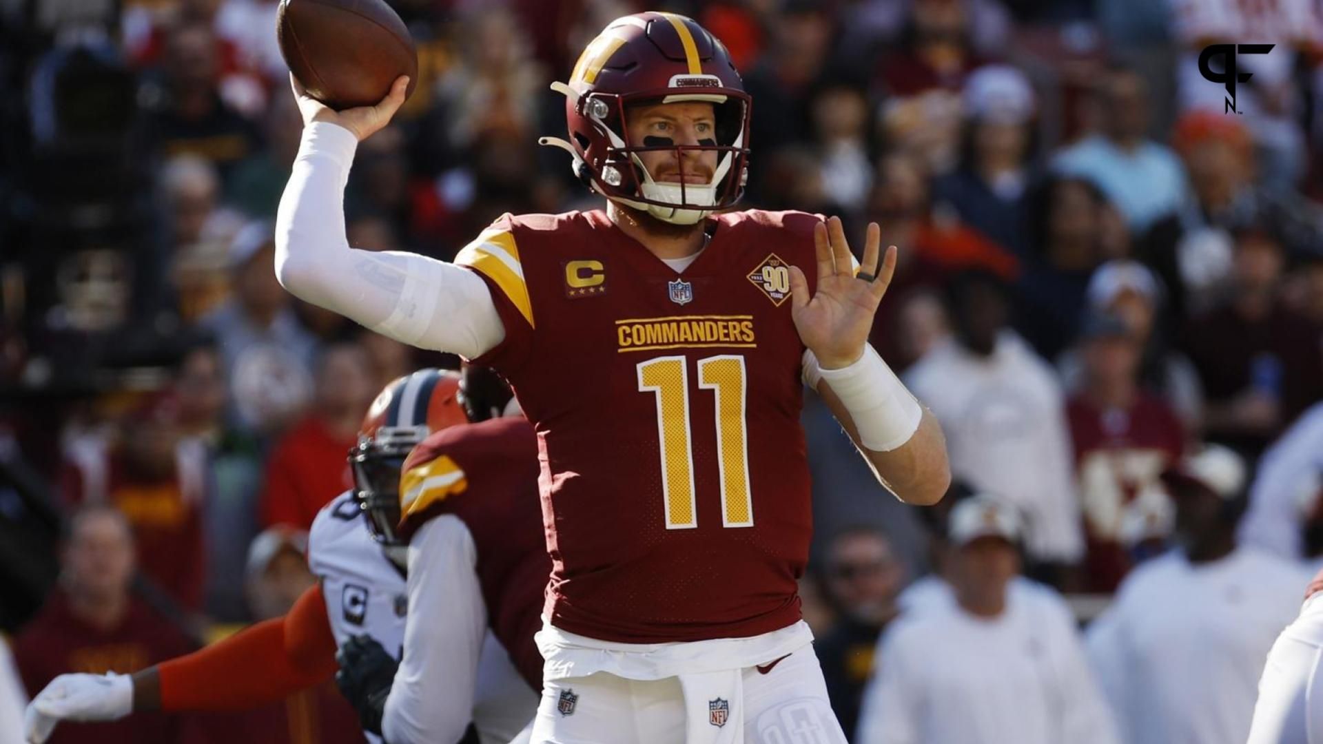 Washington Commanders quarterback Carson Wentz (11) passes the ball against the Cleveland Browns during the first quarter at FedExField.