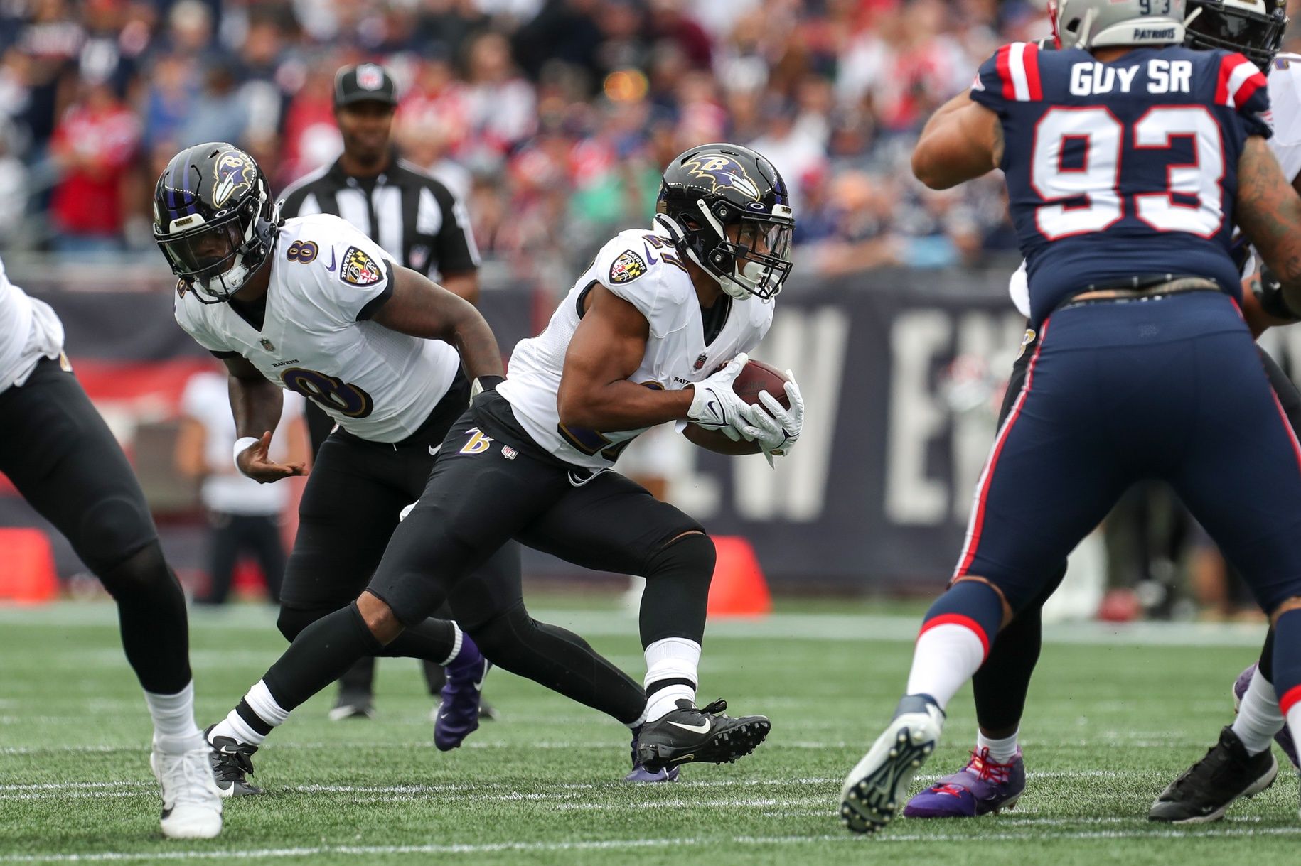 Baltimore Ravens running back JK Dobbins (27) runs the ball during the first half against the New England Patriots at Gillette Stadium.