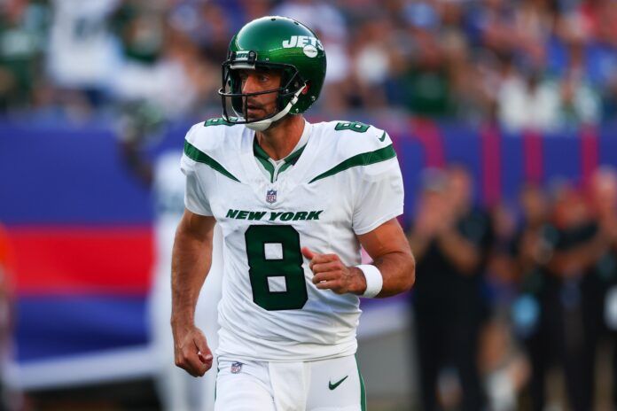 New York Jets quarterback Aaron Rodgers (8) celebrates his touchdown pass against the New York Giants.