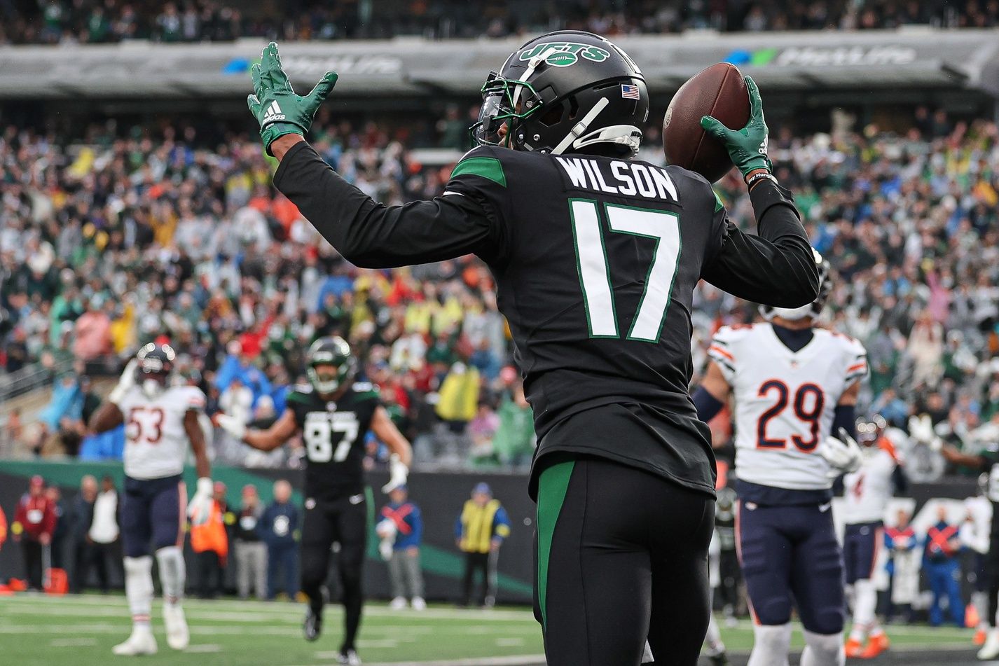Garrett Wilson (17) celebrates his touchdown reception during the first quarter against the Chicago Bears at MetLife Stadium.