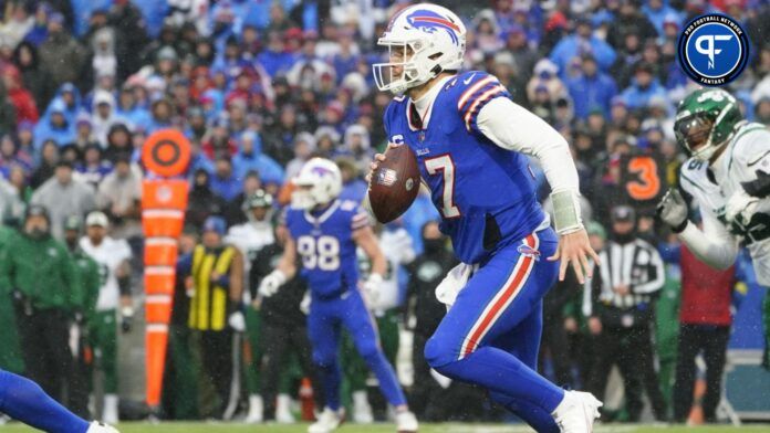 Buffalo Bills QB Josh Allen (17) runs with the ball against the New York Jets.