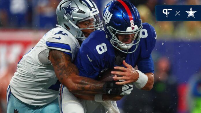 New York Giants quarterback Daniel Jones (8) is sacked by Dallas Cowboys linebacker Micah Parsons (11) during the first half at MetLife Stadium.