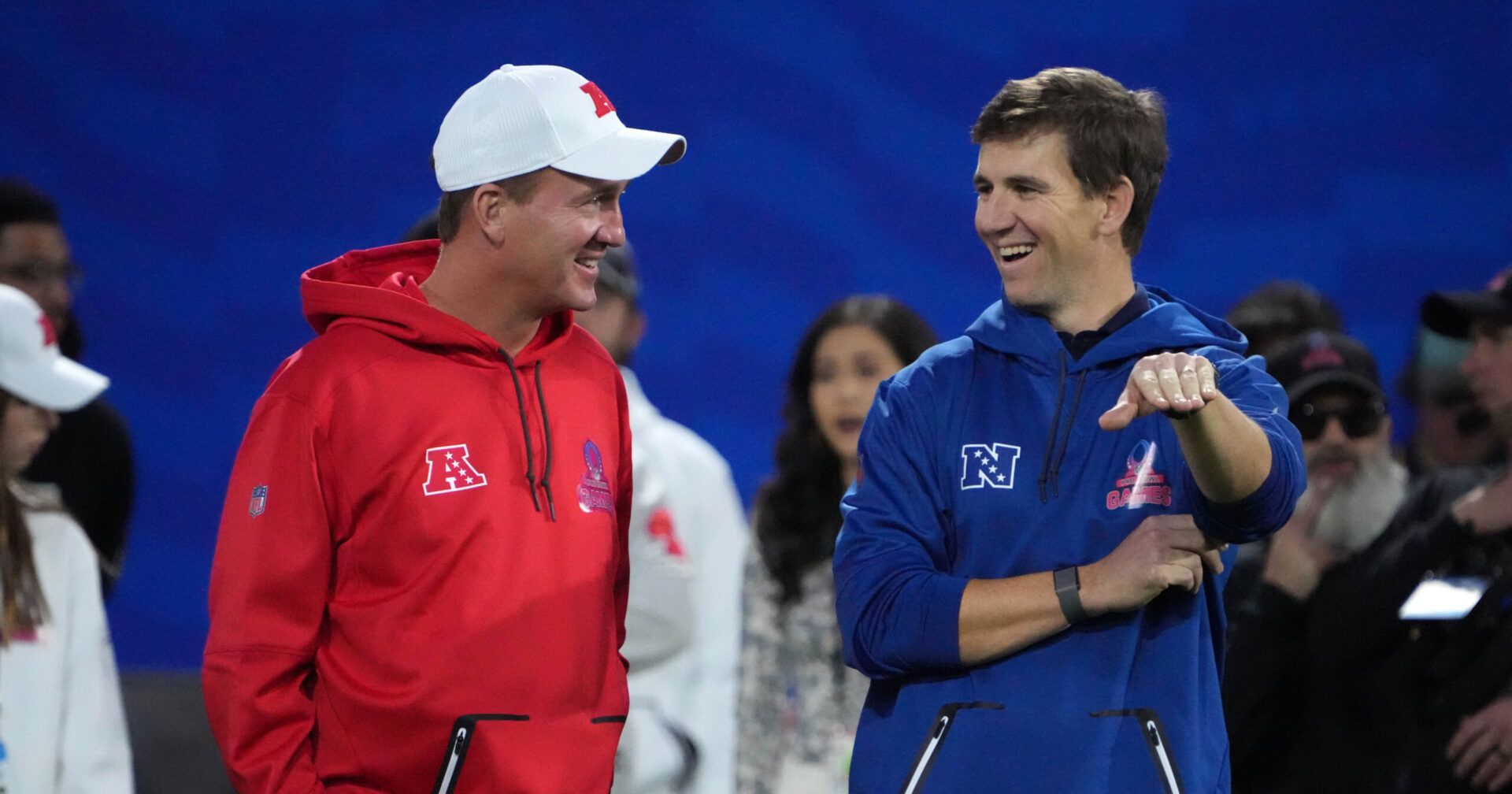 Peyton Manning (left) and Eli Manning react during the Pro Bowl Skills competition at the Intermountain Healthcare Performance Facility.