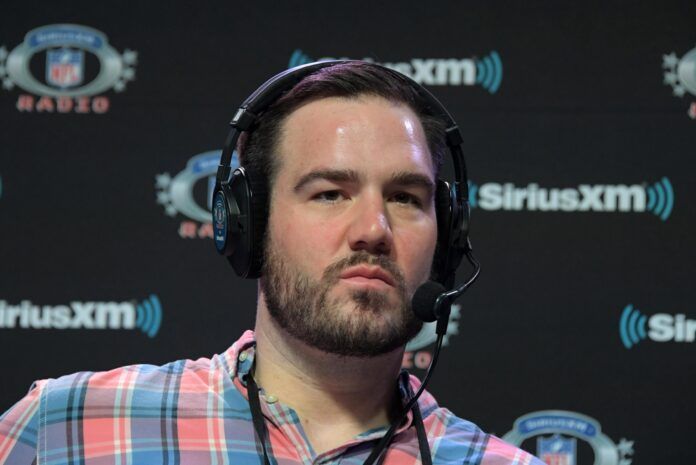 Ross Tucker on the SiriusXM NFL Radio set on radio row at the Super Bowl LIII media center at the Georgia World Congress Center.