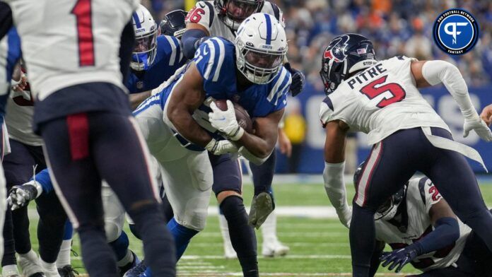 Indianapolis Colts running back Zack Moss (21) breaks tackles to rush in for a touchdown Sunday, Jan. 8, 2023, during a game against the Houston Texans at Lucas Oil Stadium in Indianapolis.