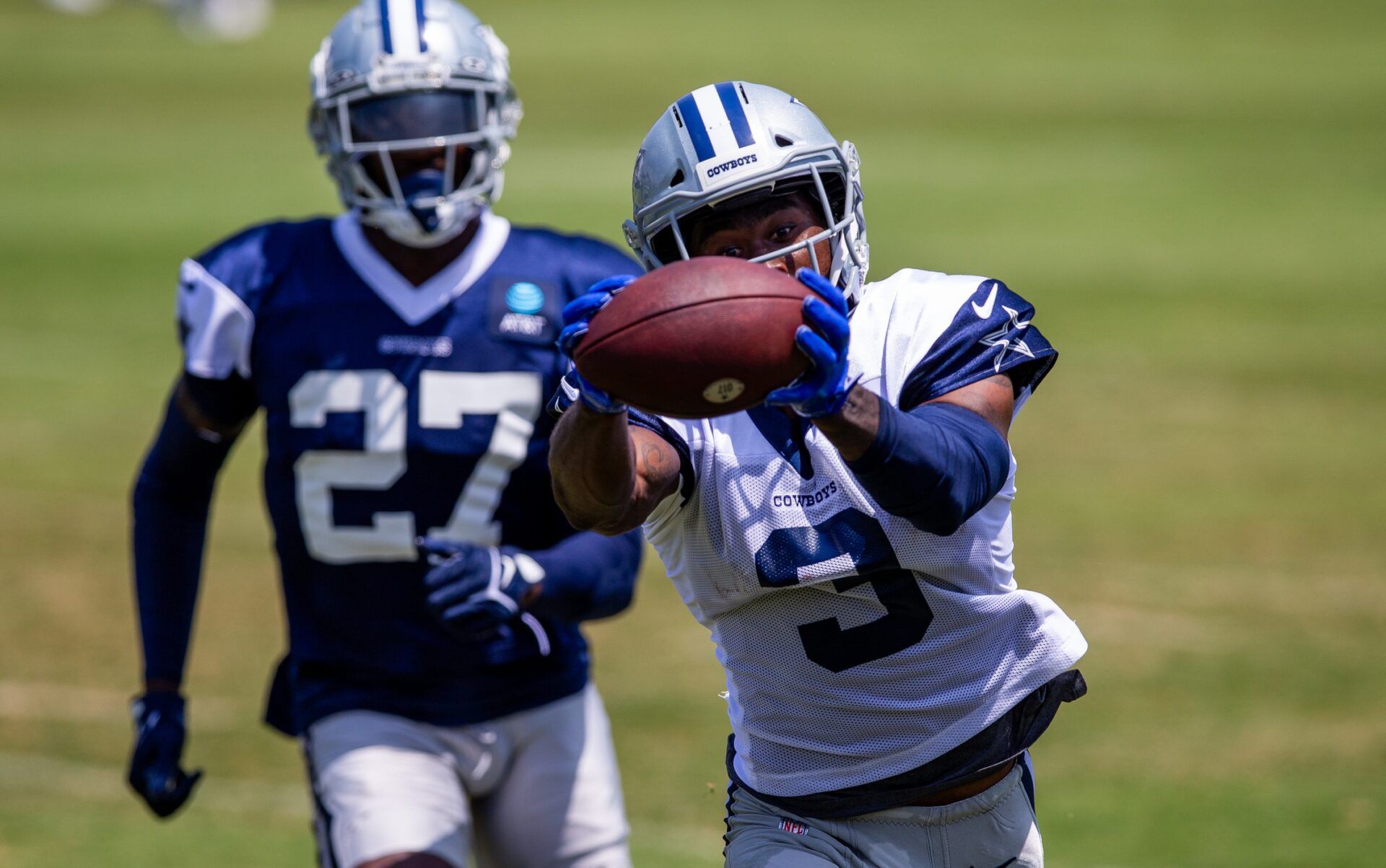 Dallas Cowboys wide receiver Brandin Cooks (3) makes a catch in front of safety Jayron Kearse (27) during training camp at the Marriott Residence Inn-River Ridge playing fields.
