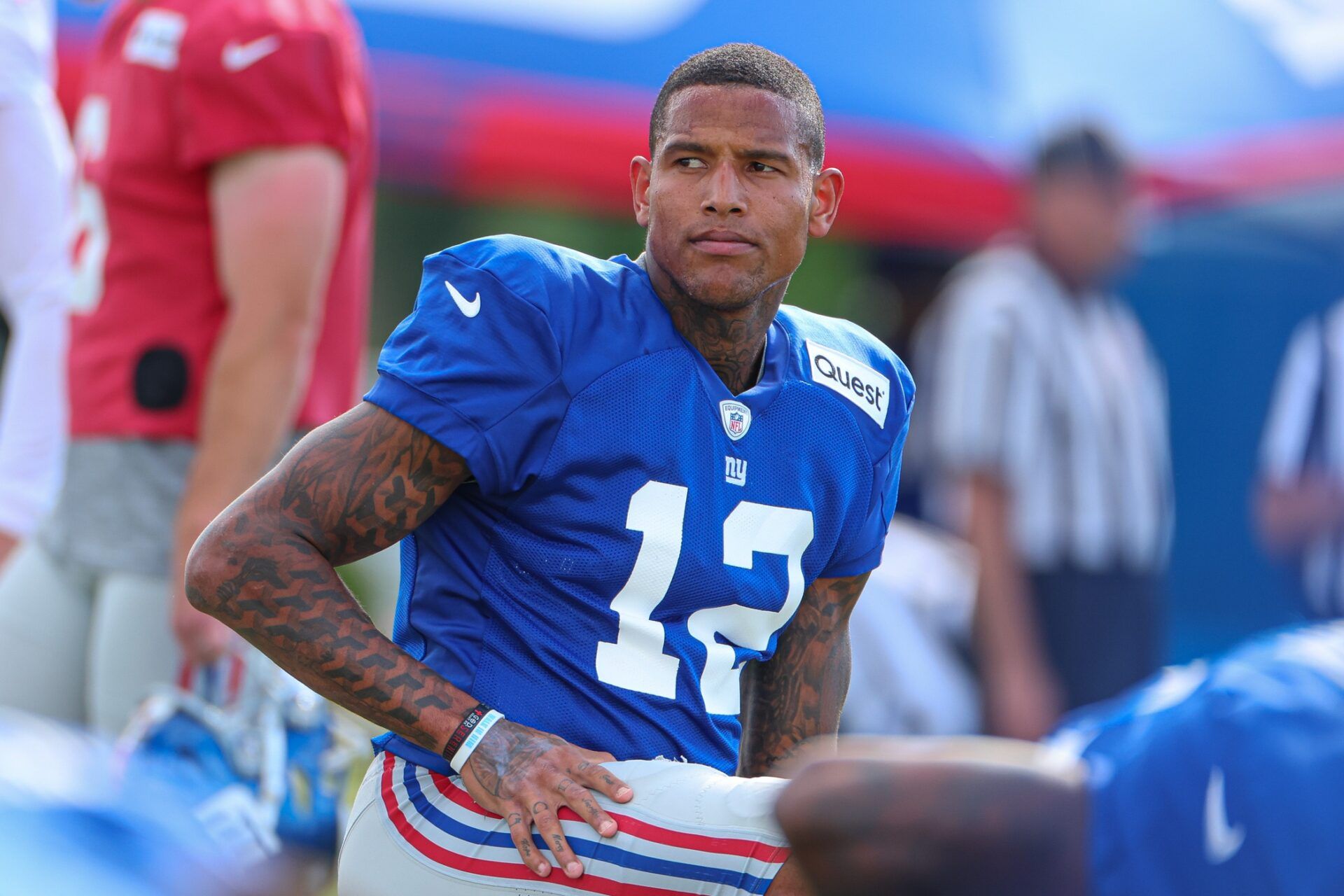 New York Giants tight end Darren Waller (12) stretches during training camp at the Quest Diagnostics Training Facility.