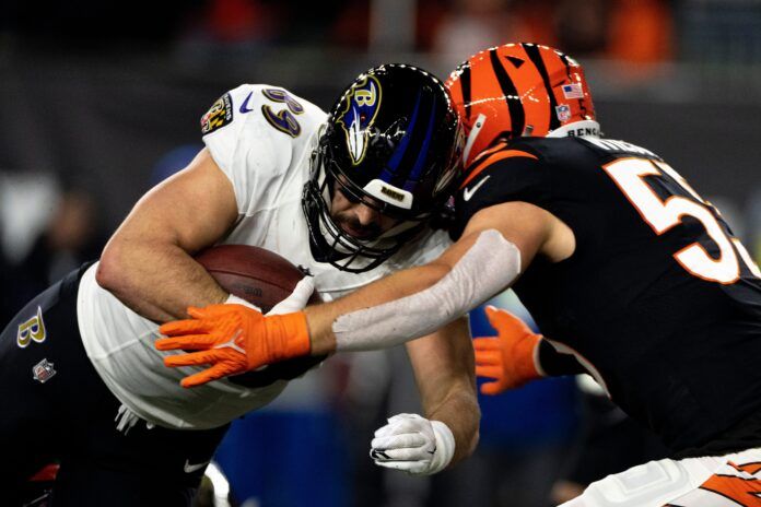 Cincinnati Bengals linebacker Logan Wilson (55) hits Baltimore Ravens tight end Mark Andrews (89) in the second quarter during an NFL wild-card playoff football game between the Baltimore Ravens and the Cincinnati Bengals, Sunday, Jan. 15, 2023, at Paycor Stadium in Cincinnati. Baltimore Ravens At Cincinnati Bengals Afc Wild Card Jan 15 114