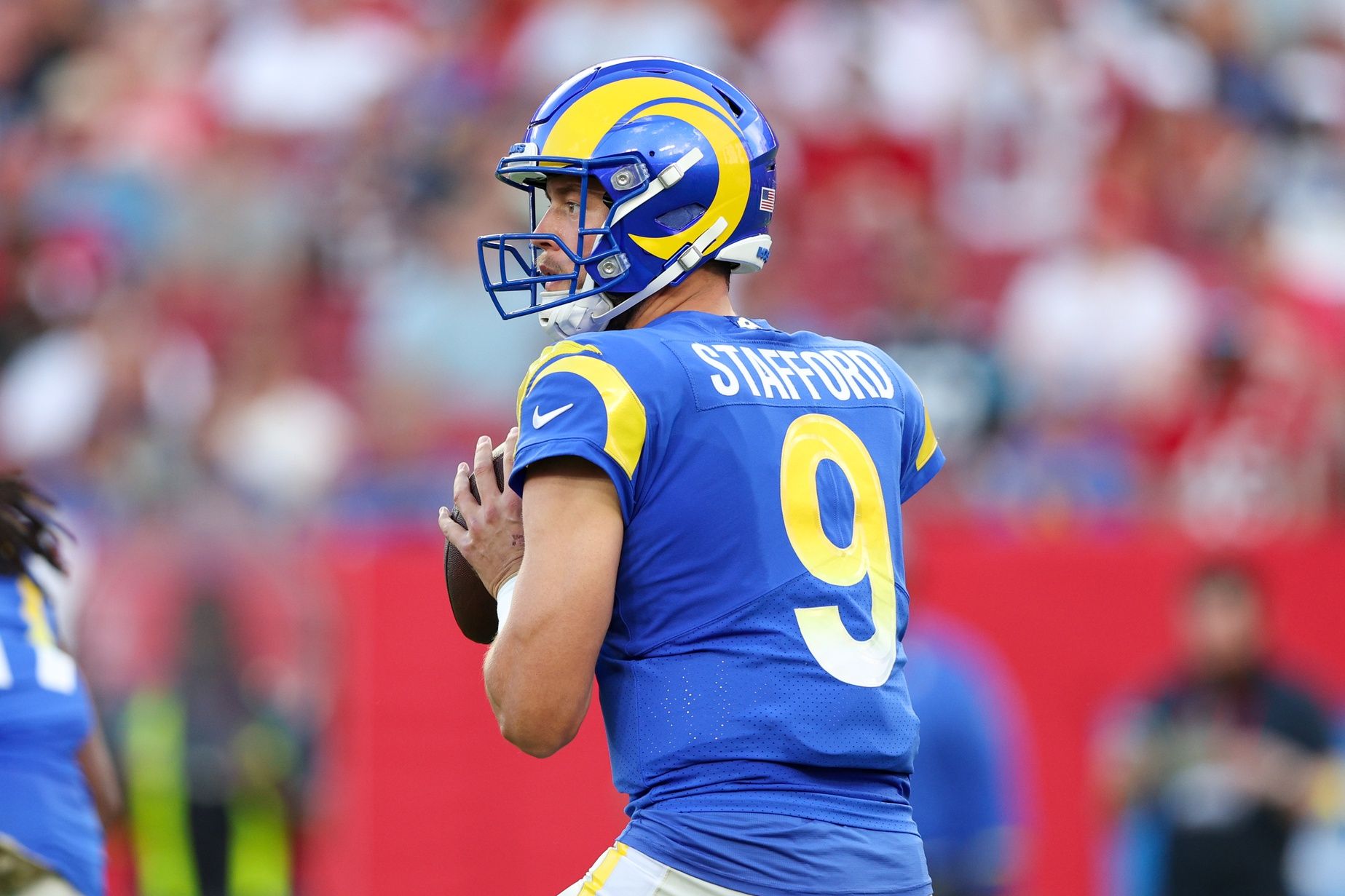 Matthew Stafford (9) drops back to pass against the Tampa Bay Buccaneers in the first quarter at Raymond James Stadium.