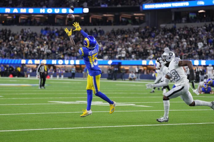 Los Angeles Rams wide receiver Tutu Atwell (15) catches a pass against Las Vegas Raiders cornerback Nate Hobbs (39) in the second half at SoFi Stadium.