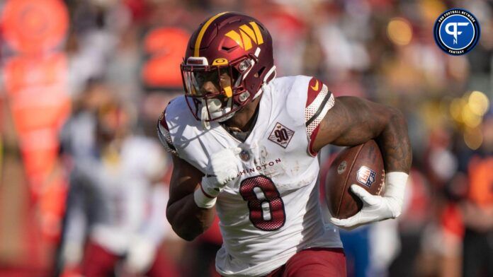 Washington Commanders RB Brian Robinson rushes for a gain against the 49ers.