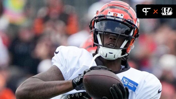 Tee Higgins (5) catches a throw during a preseason training camp practice at the Paycor Stadium training facility in downtown Cincinnati.