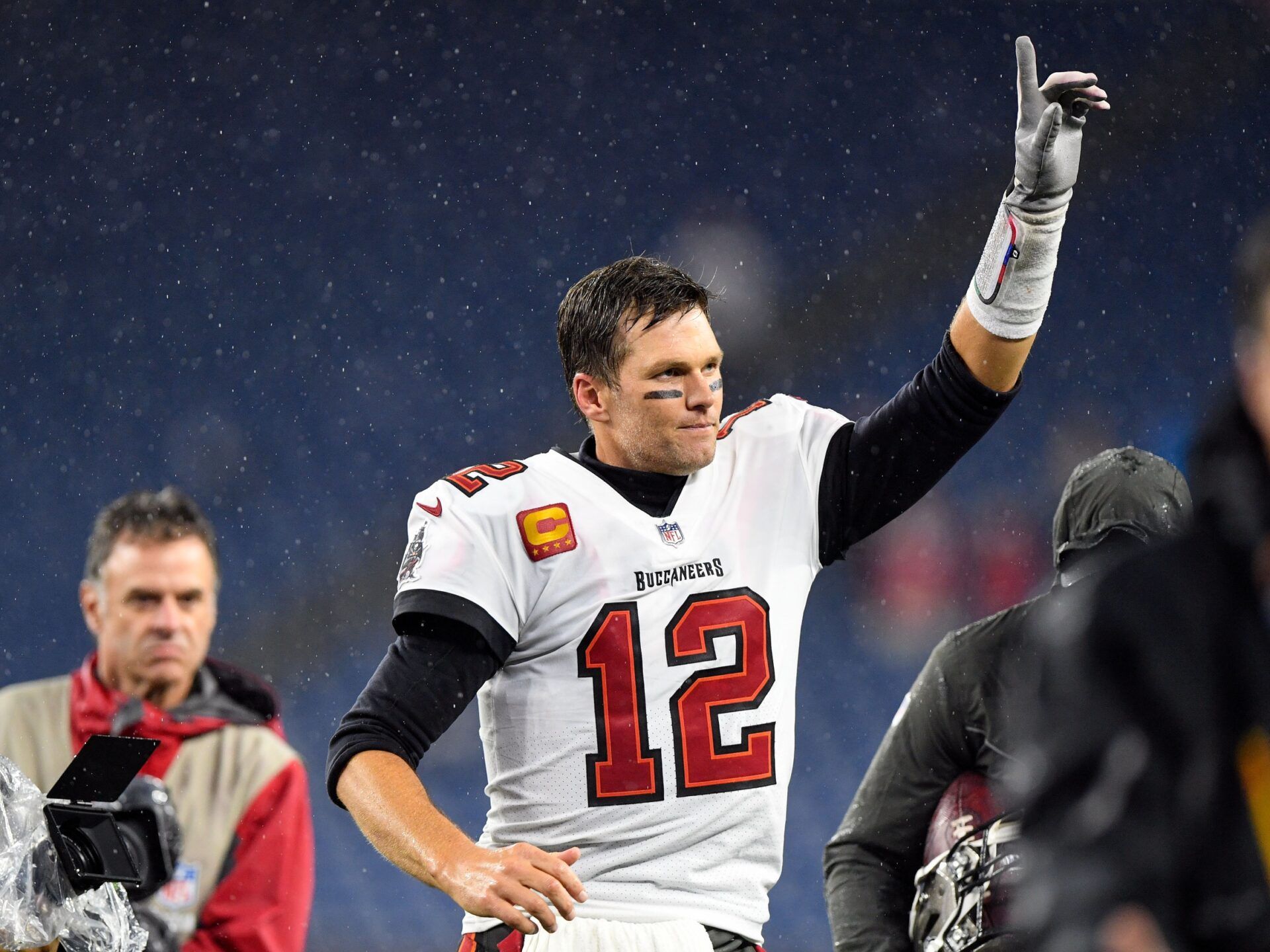 Tom Brady (12) reacts as he runs off of the field after a game against the New England Patriots at Gillette Stadium.