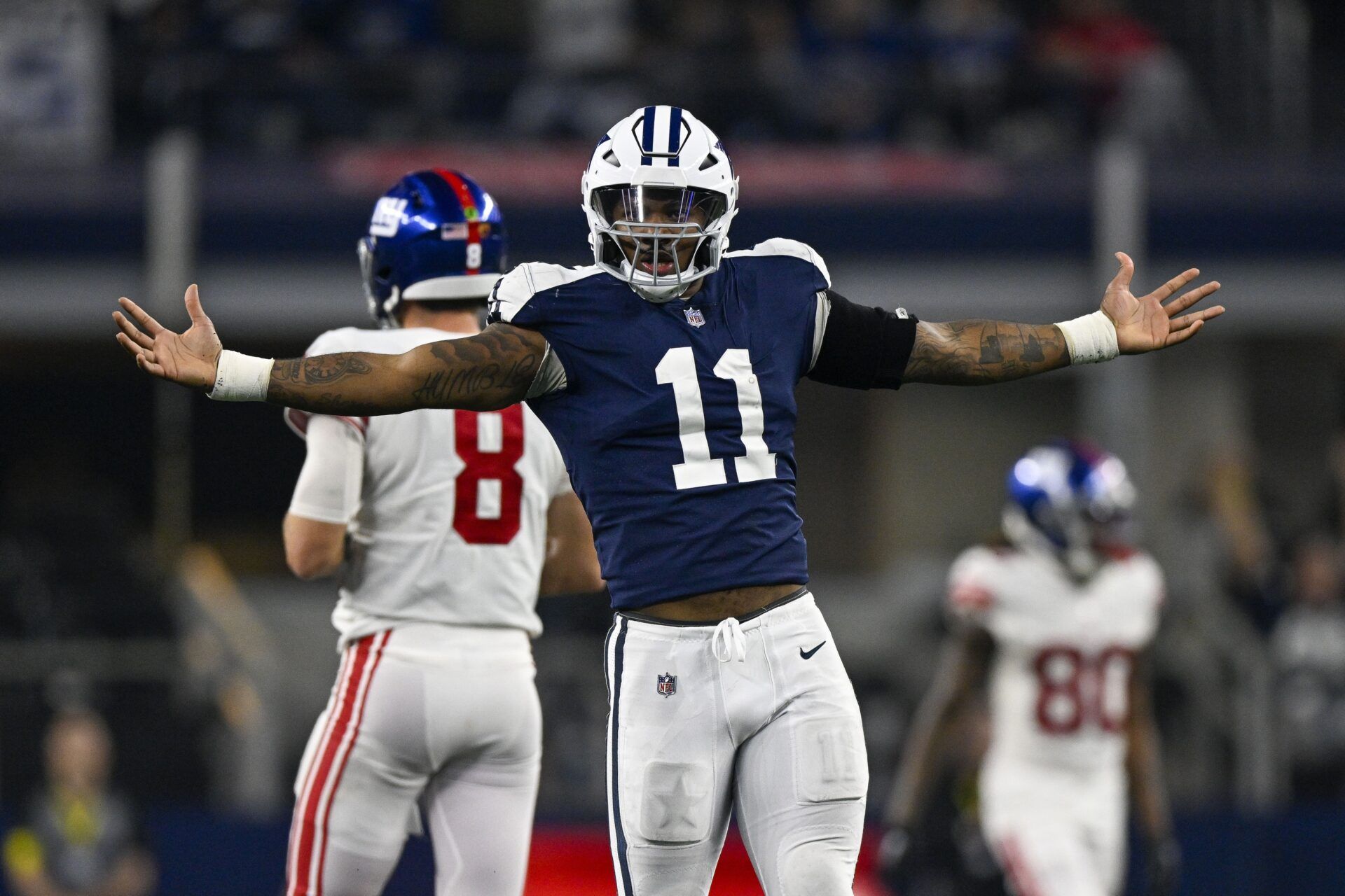 Micah Parsons (11) celebrates after he sacks New York Giants quarterback Daniel Jones (8) during the game between the Dallas Cowboys and the New York Giants at AT&T Stadium.
