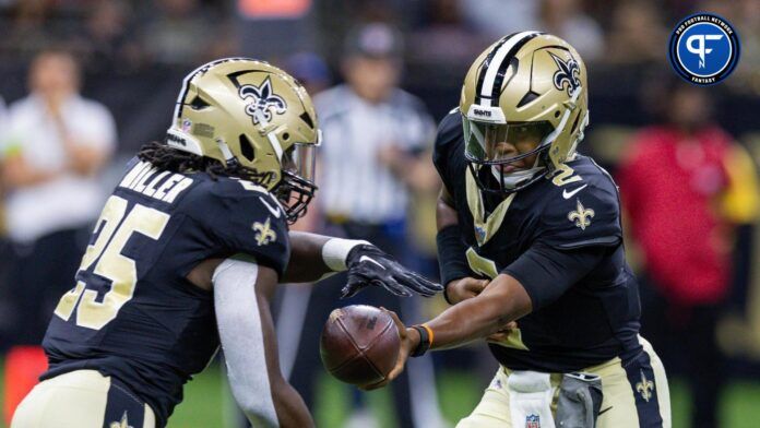 New Orleans Saints quarterback Jameis Winston (2) hands the ball off to running back Kendre Miller (25) against the Houston Texans during the first half at the Caesars Superdome.