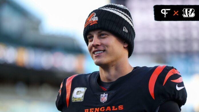 Joe Burrow looks on from the field in an NFL game.