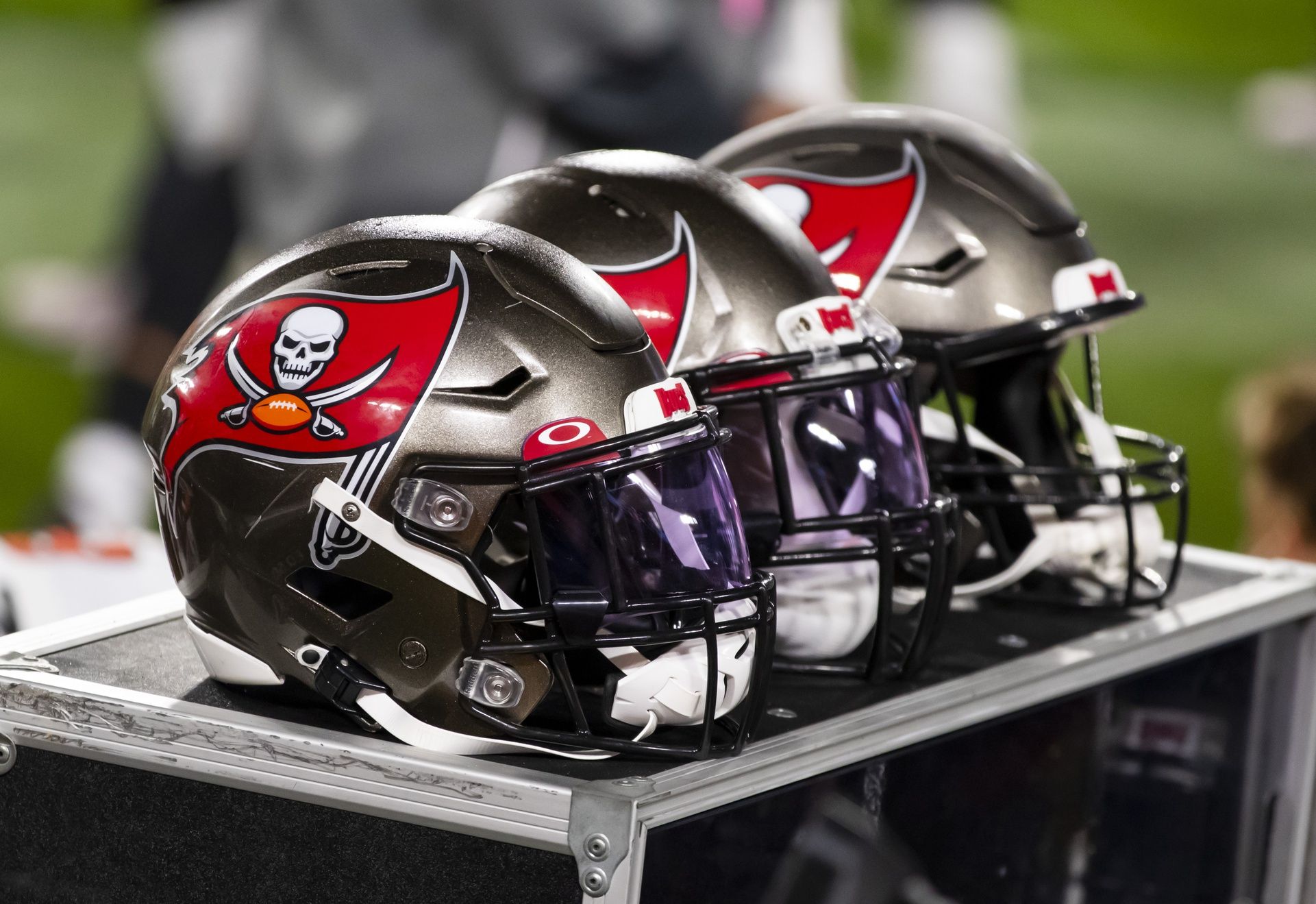 Detailed view of Tampa Bay Buccaneers helmets on the sidelines against the Kansas City Chiefs in Super Bowl LV at Raymond James Stadium.