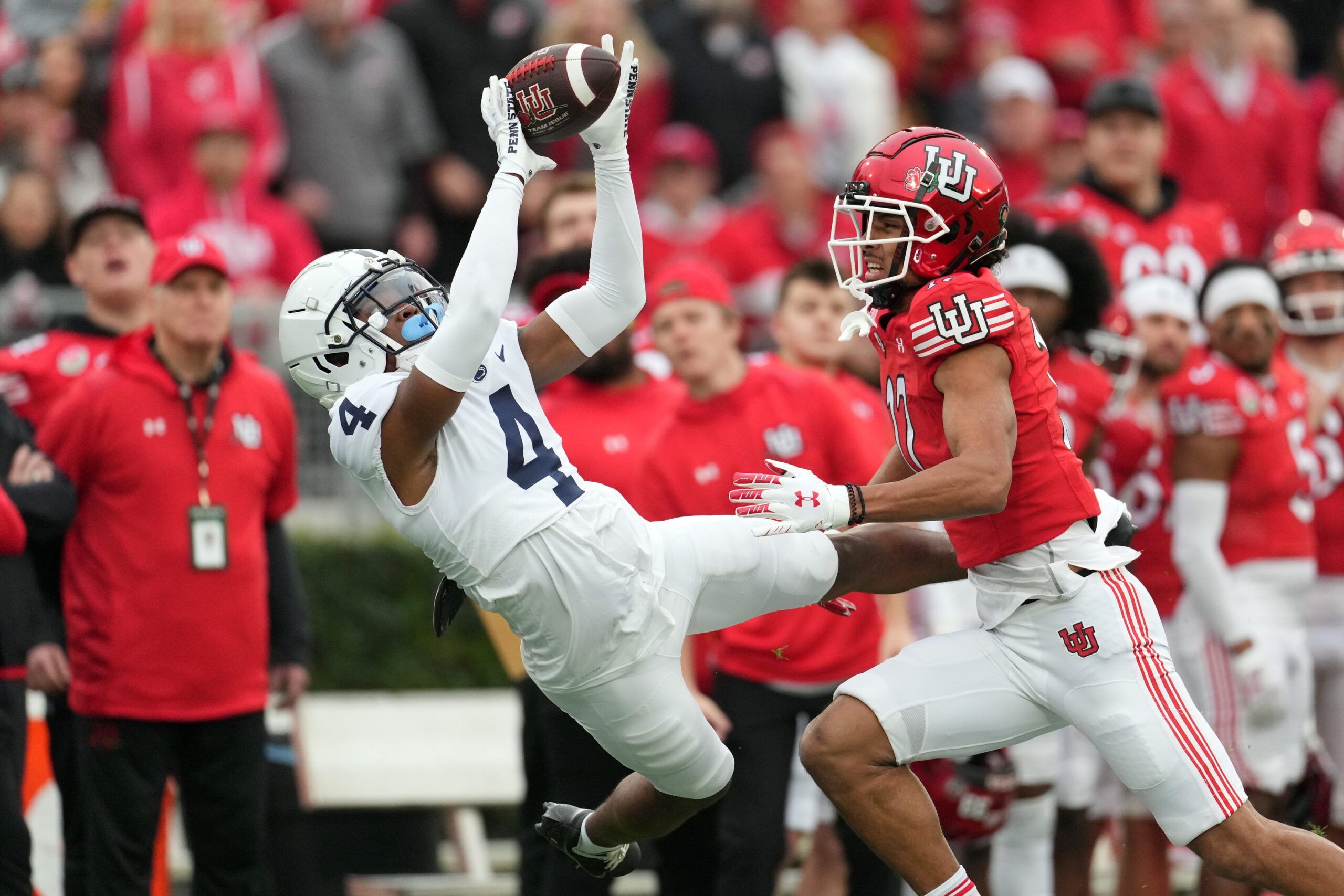 Kalen King (4) makes an catch against Utah Utes wide receiver Devaughn Vele (17) in the first half of the 109th Rose Bowl game at the Rose Bowl.