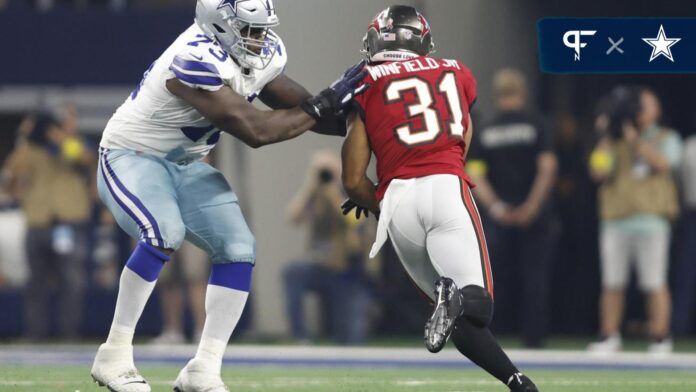 Dallas Cowboys OL Tyler Smith blocks Antoine Winfield Jr. of the Tampa Bay Buccaneers.