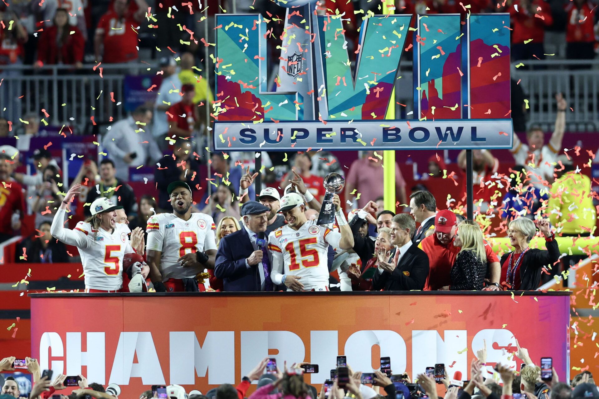 Kansas City Chiefs quarterback Patrick Mahomes (15) celebrates on the podium with the Vince Lombardi Trophy after the Kansas City Chiefs defeated the Philadelphia Eagles in Super Bowl LVII at State Farm Stadium.