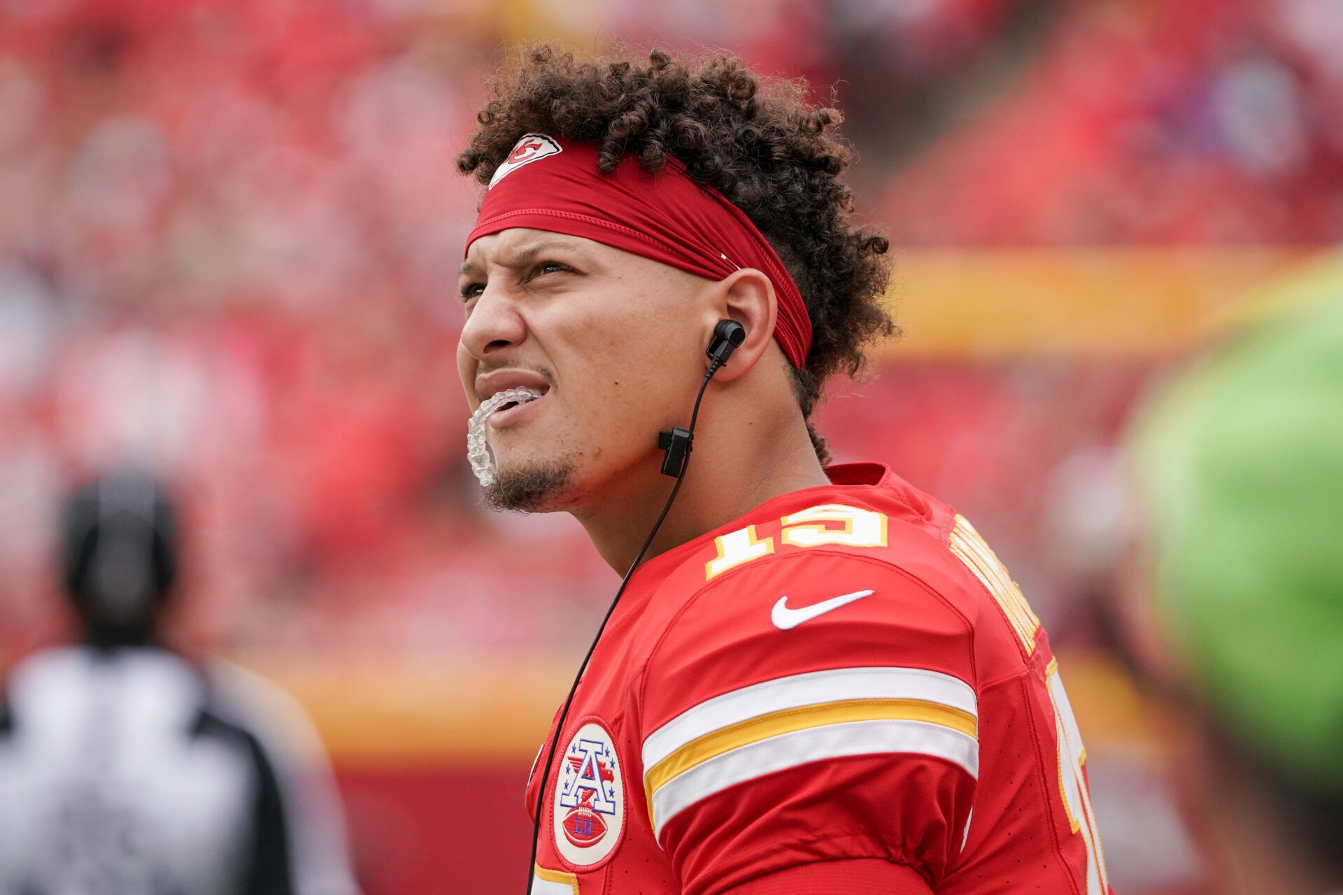 Kansas City Chiefs quarterback Patrick Mahomes (15) watches the replay screen against the Cleveland Browns during the game at GEHA Field at Arrowhead Stadium.