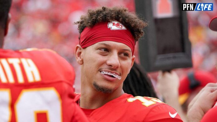 Kansas City Chiefs quarterback Patrick Mahomes (15) laughs on the sidelines against the Cleveland Browns during the first half at GEHA Field at Arrowhead Stadium.