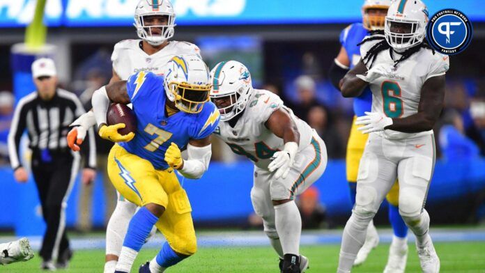 Los Angeles Chargers tight end Gerald Everett (7) runs the ball against Miami Dolphins defensive tackle Christian Wilkins (94) during the second half at SoFi Stadium.