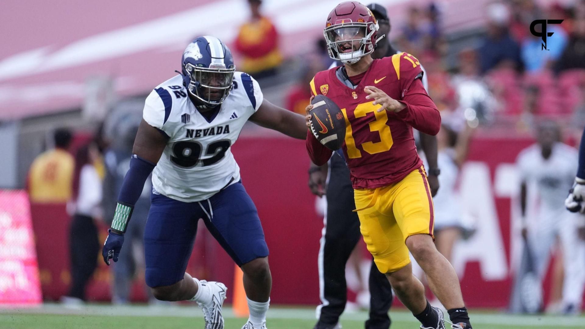 Southern California Trojans quarterback Caleb Williams (13) is pressured by Nevada Wolf Pack defensive end Dion Washington (92).