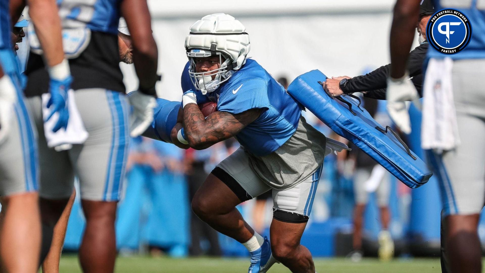 Detroit Lions running back David Montgomery (5) runs a drill during a joint practice with New York Giants at Detroit Lions headquarters and training facility in Allen Park on Tuesday, August 8, 2023.