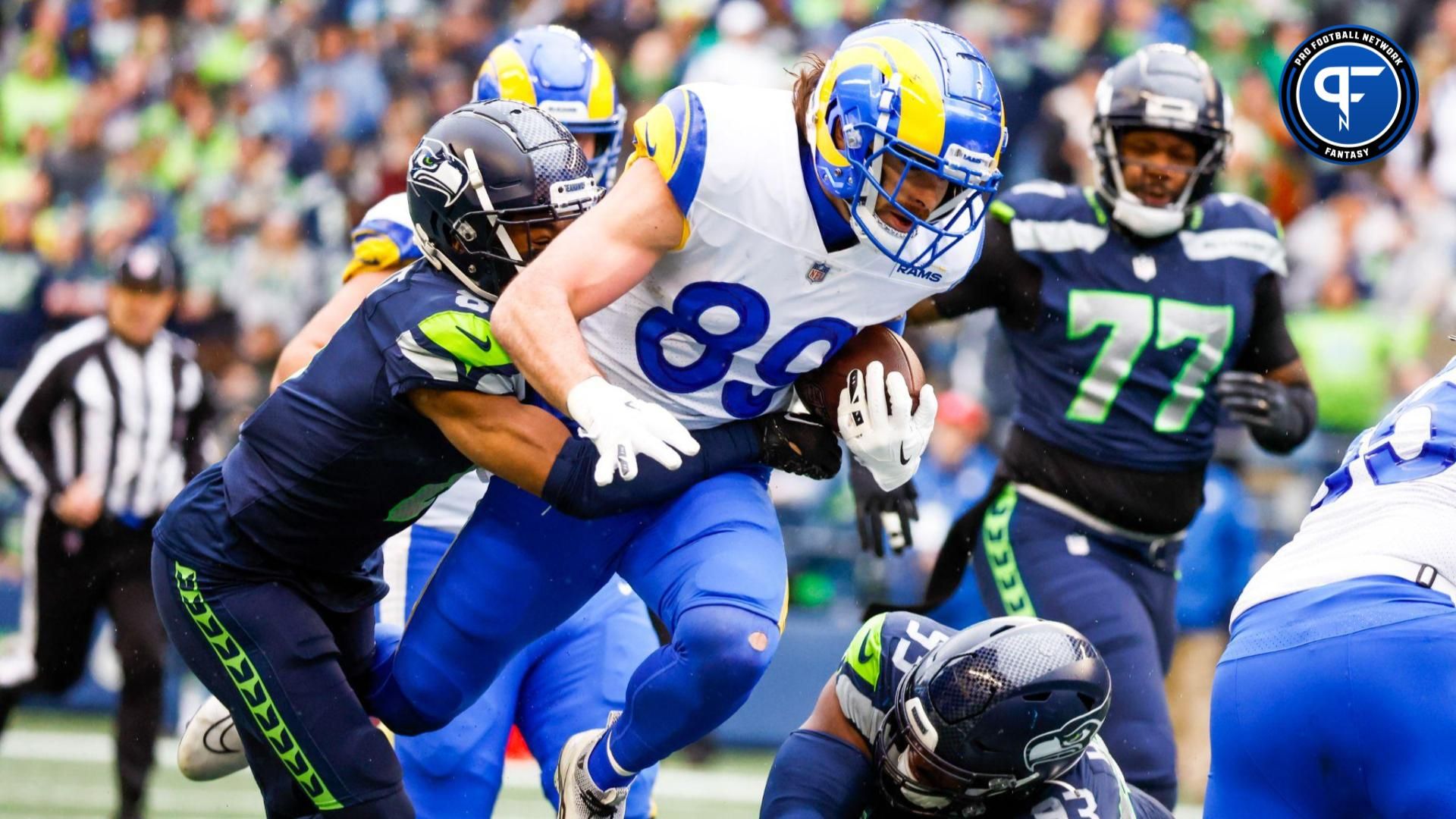 Los Angeles Rams tight end Tyler Higbee (89) runs for yards after the catch agains Seattle Seahawks cornerback Coby Bryant (8) during the second quarter at Lumen Field.