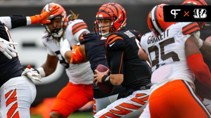 Cincinnati Bengals quarterback Joe Burrow (9) protects the ball in the pocket under pressure from Cleveland Browns defensive end Myles Garrett (95) in the second quarter of the NFL Week 14 game between the Cincinnati Bengals and the Cleveland Browns at Paycor Stadium in Cincinnati on Sunday, Dec. 11, 2022. The Bengals led 13-3 at halftime.