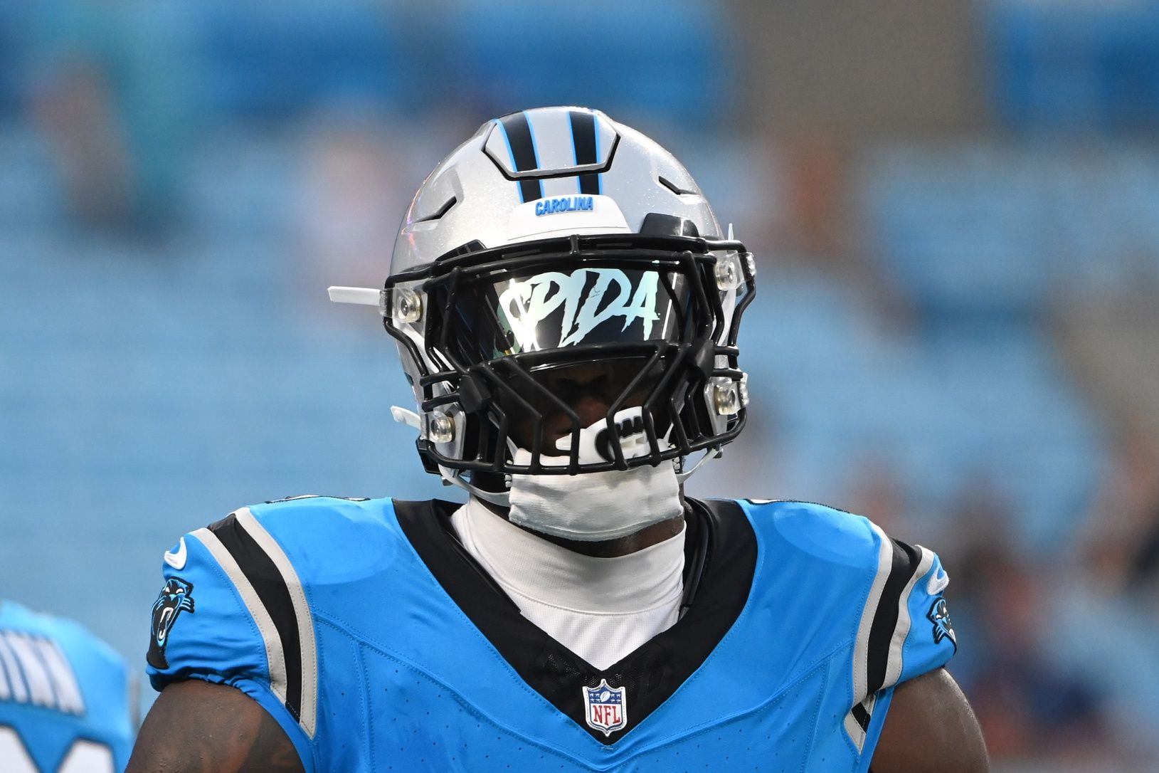 Brian Burns (0) warms up before the game at Bank of America Stadium.