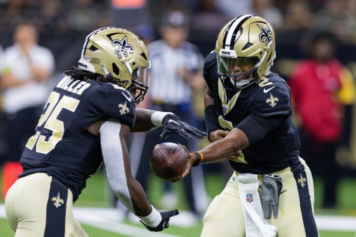 New Orleans Saints quarterback Jameis Winston (2) hands the ball off to running back Kendre Miller (25) against the Houston Texans during the first half at the Caesars Superdome.