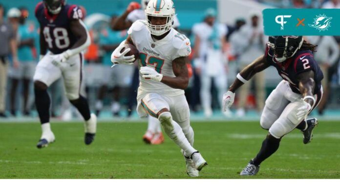 Miami Dolphins wide receiver Jaylen Waddle carries the football.