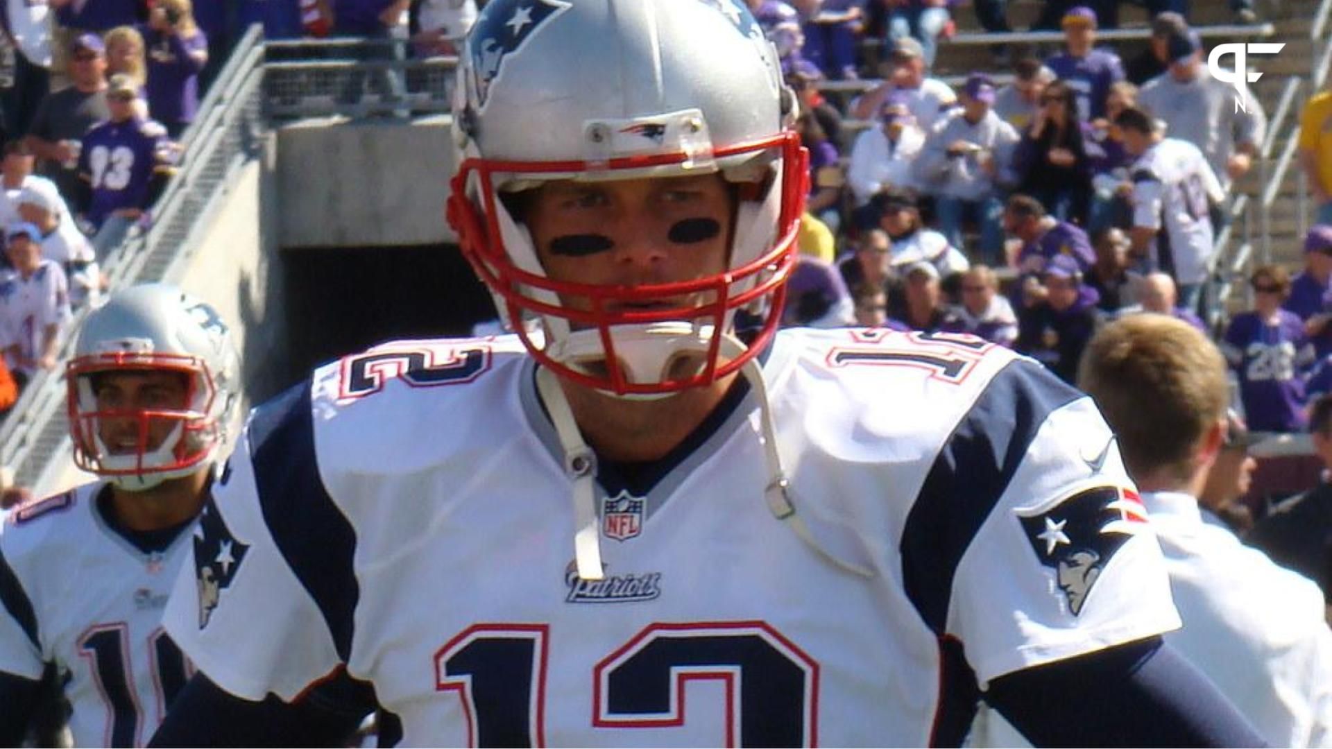 Quarterback Tom Brady (12) coming out of the tunnel with his New England Patriots teammates.