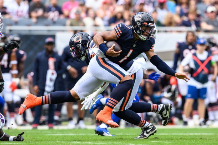 Chicago Bears QB Justin Fields carries the football.