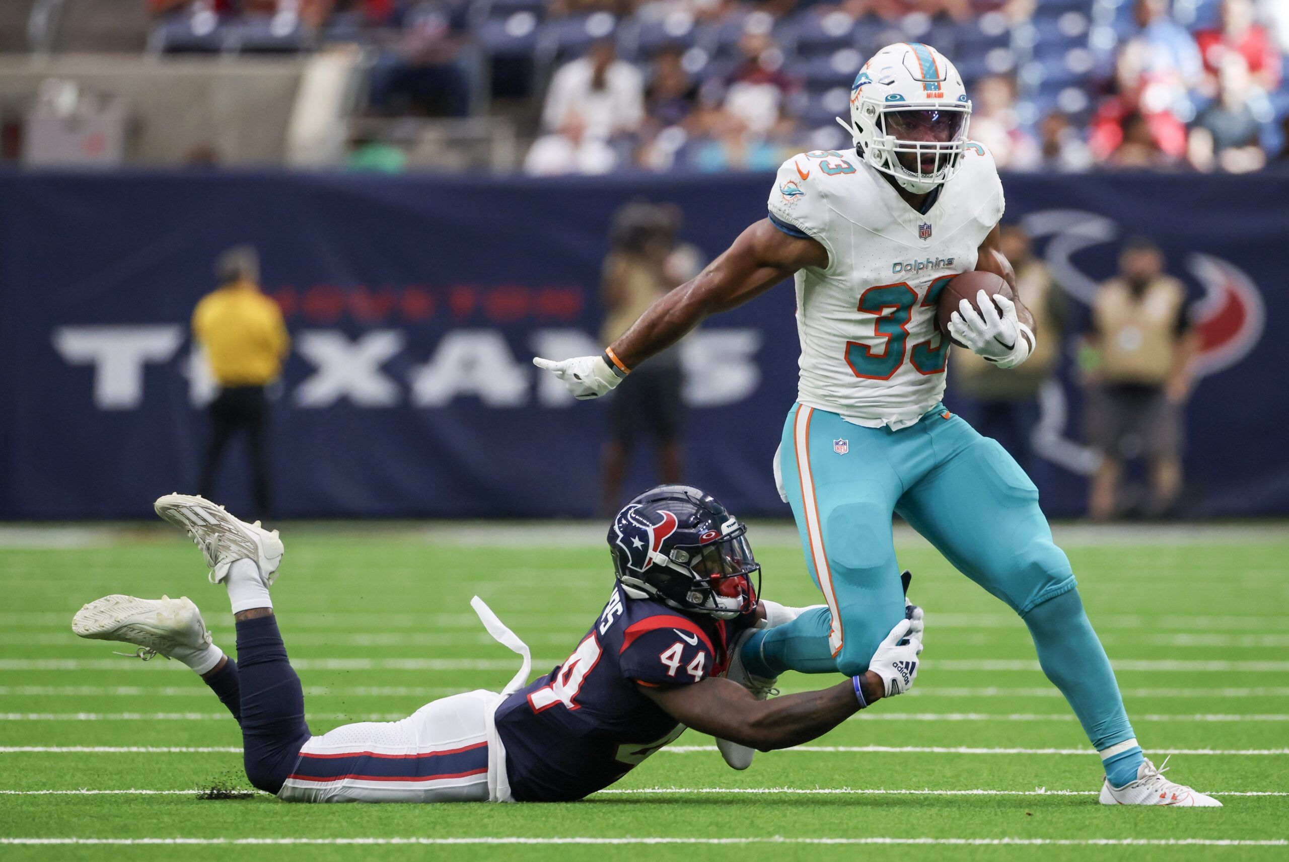 Chris Brooks (33) breaks the tackle of Houston Texans cornerback Darius Phillips (44) in the fourth quarter at NRG Stadium.