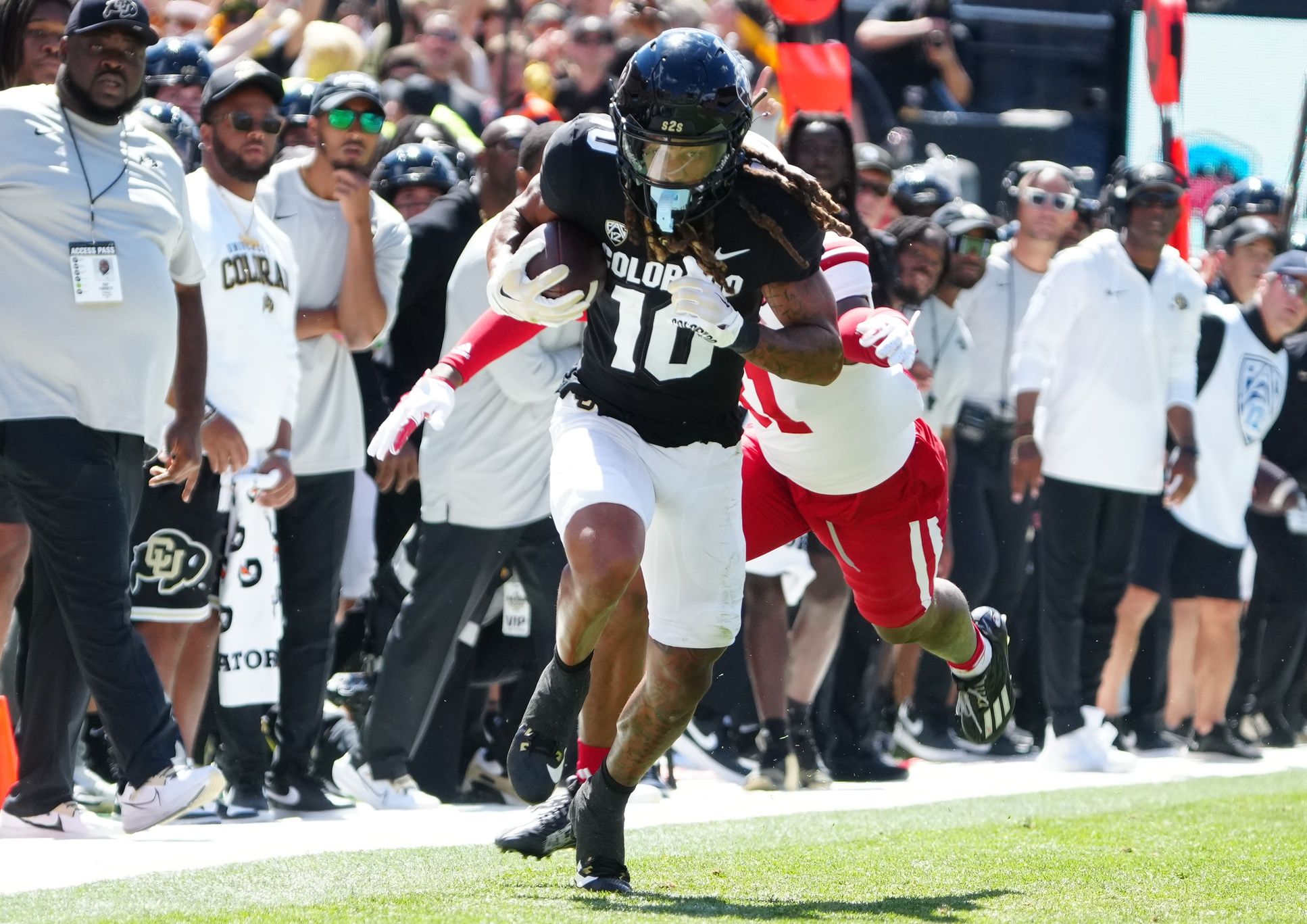 Xavier Weaver (10) runs after a reception in the third quarter against the Nebraska Cornhuskers at Folsom Field.